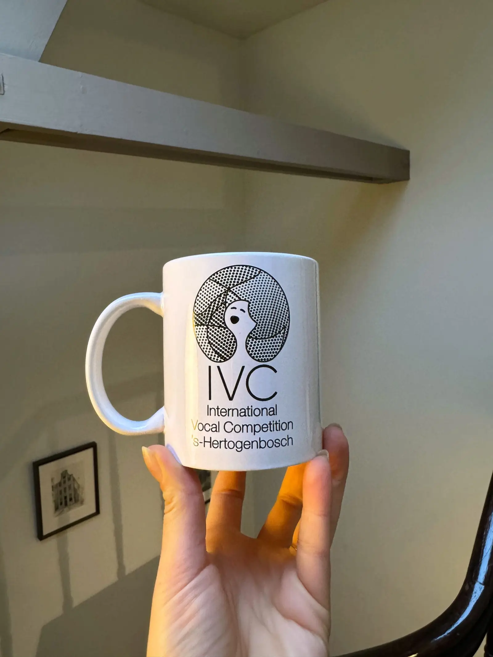 IVC mug held in hand